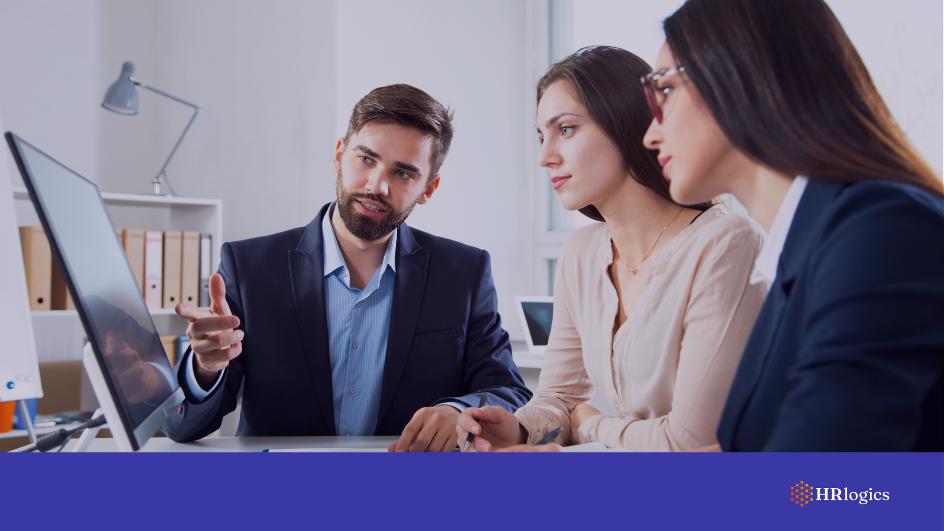 An HR manager, a compliance officer, and a hiring supervisor reviewing E-Verify+ and I-9 compliance on a computer screen, representing streamlined verification and regulatory alignment.
